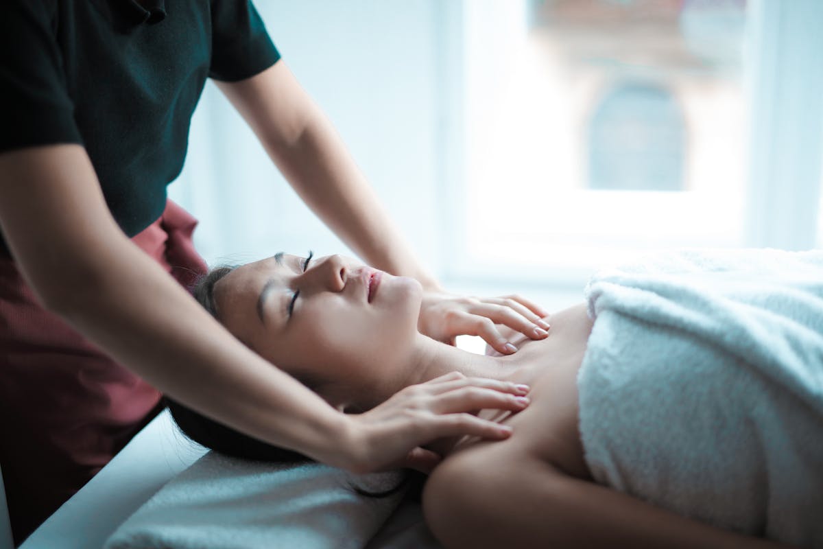 Woman receiving professional body treatment at modern Sydney clinic
