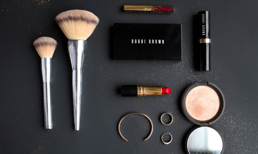 Sydney beauty gift voucher styling — minimalist gold and white packaging on linen