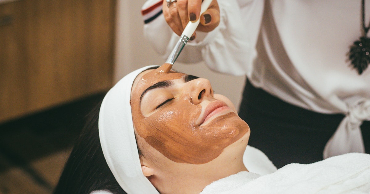 Mature woman discussing skincare with aesthetic clinician