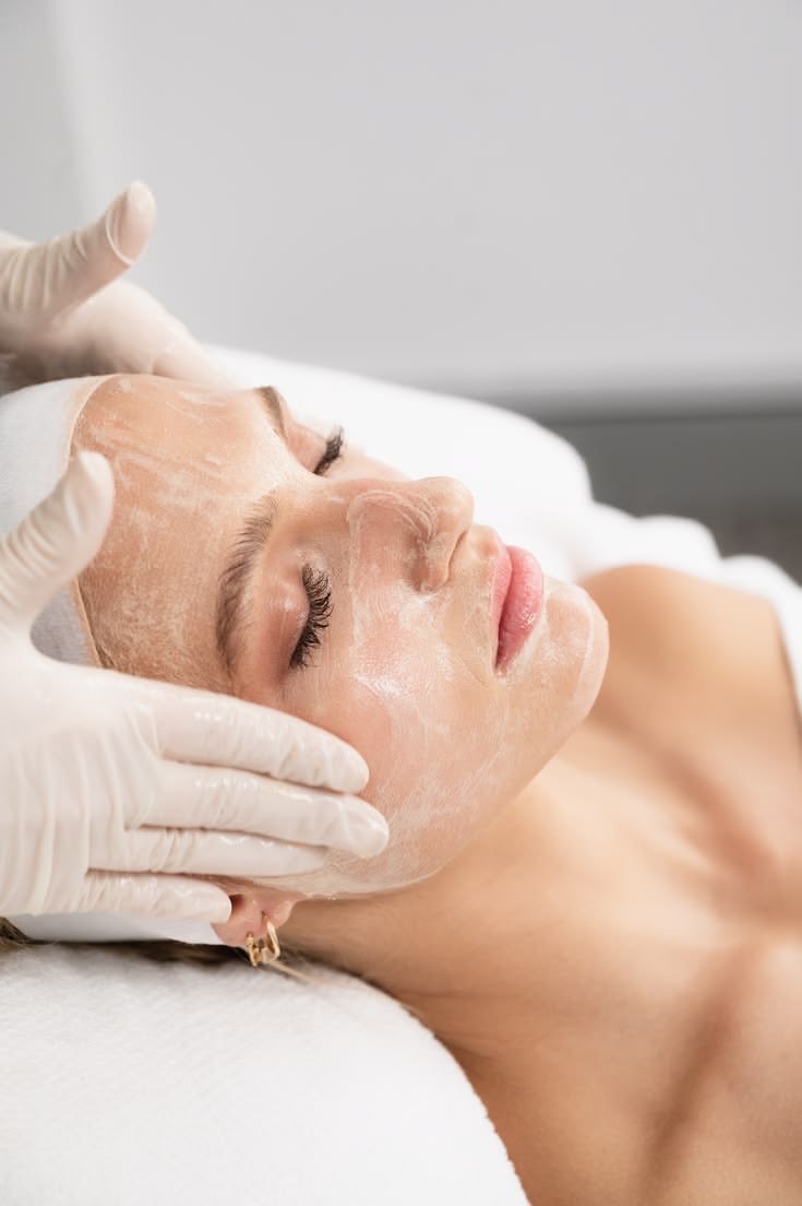 Gentle facial cleansing with cream and gloved hands
